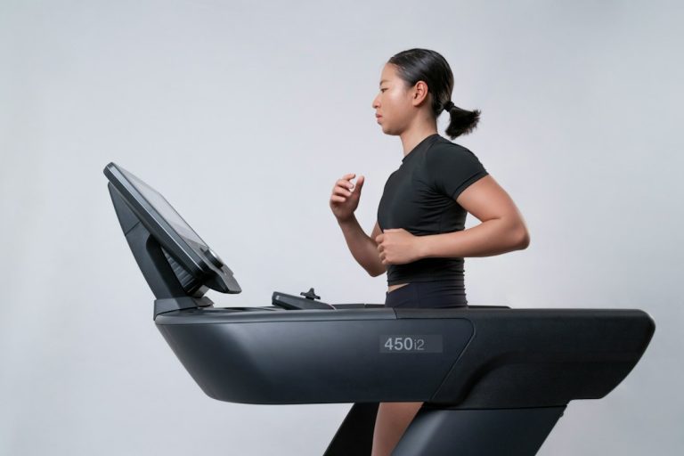 Runner using a premium treadmill during a guided workout